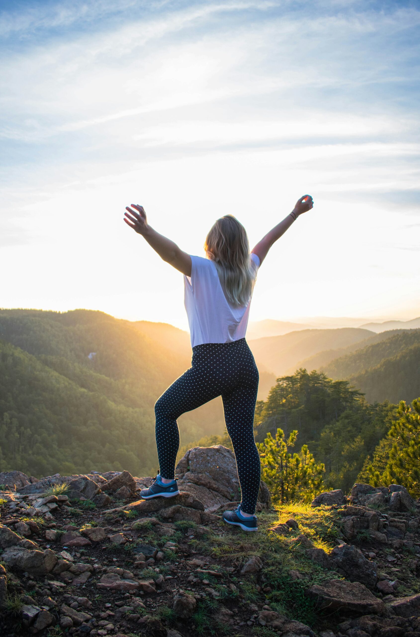 Woman standing on Mountain Joy of Serenity Travel